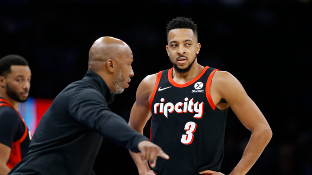 Jan 31, 2022; Oklahoma City, Oklahoma, USA; Portland Trail Blazers head coach Chauncey Billups talks to Portland Trail Blazers guard CJ McCollum (3) between plays against the Oklahoma City Thunder during the second quarter at Paycom Center.